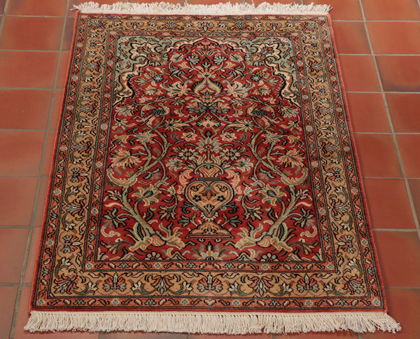 A beautiful Kashmir silk rug in a prayer rug design with tree of