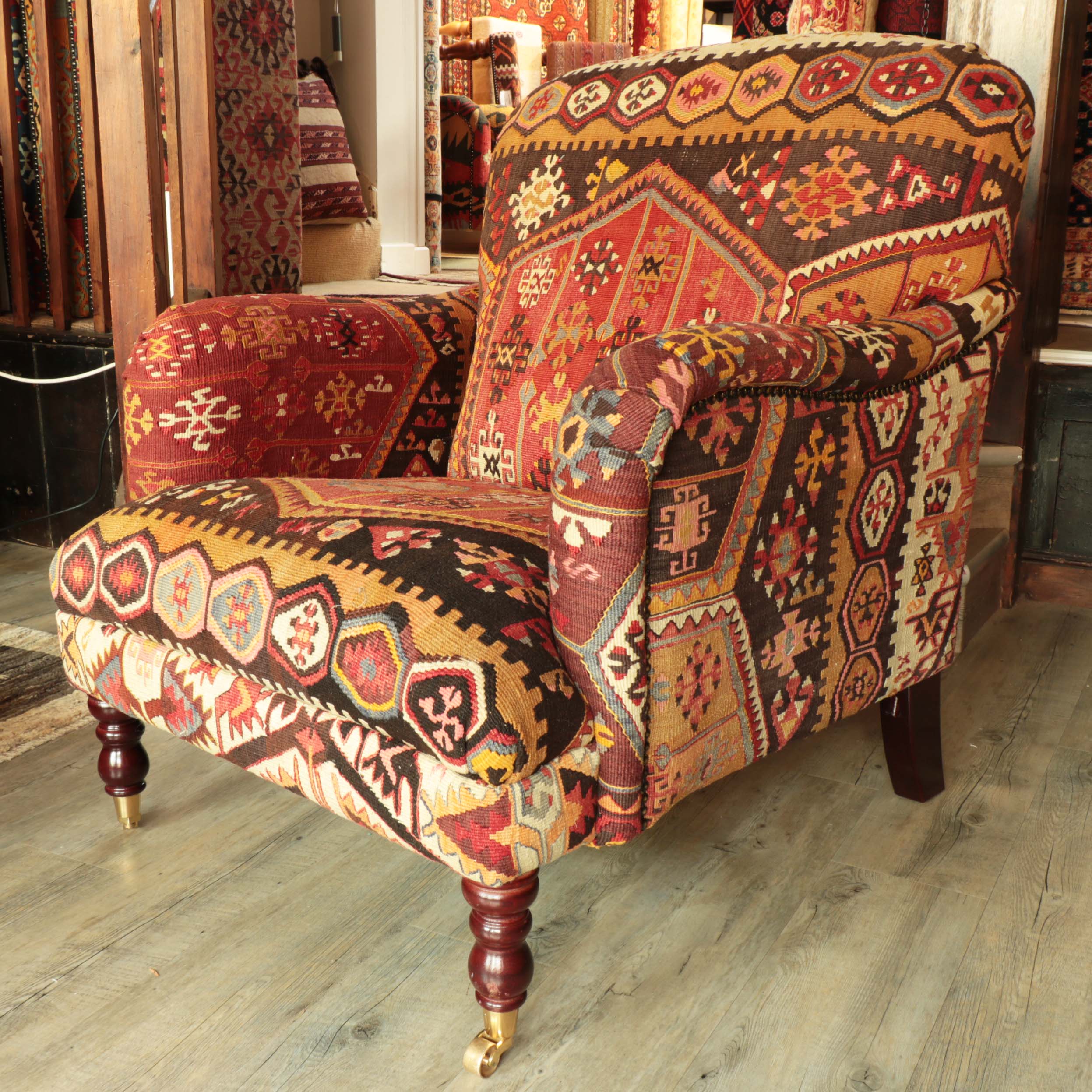 Howard style chair covered in old Turkish kilim in red and tan