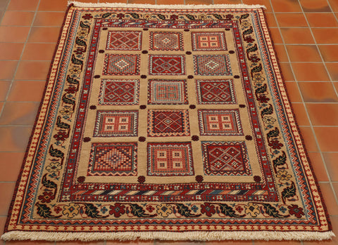 Blocks of decorated flat weave, almost tapestry are surrounded by a woven pile border.  There are then additional borders that are decorated and a mix of the two types.  The colours used are cream, reds, light and dark blues. 