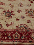A hand knotted Afghan Ziegler runner with a cream background and soft red border.