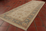 A lovely example of an Afghan Ziegler with a very light cream central ground and a main border of soft blue. This runner would look great on an upstairs landing or bedroom where the use might be a little lighter. The cream may struggle in a main hallway. It is a hand knotted runner made from wool on a cotton foundation