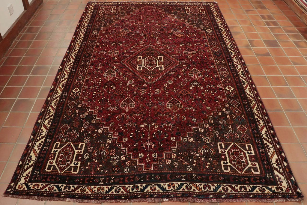 A hand knotted tribal rug from southern Iran made from wool.