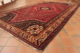We would describe this Persian hand made tribal rug as semi old. It has some evidence of wear in a very small area.