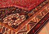 The border design this rugs is very vibrant as are the colours used through the piece which have been set against a lovely vegetable dyed madder red background colour