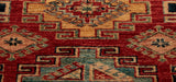The main colour used in the Kazak rug is a warm brick red and they have used cream, soft blue and dark blue to highlight the design.