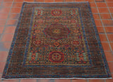 This fine, detailed and delicate Mamluk measures 147 by 101 centimetres.  The electric blue stands out against the mocha shade and really brings the rug to life.   The central medallion is surrounded by an area of decoration consisting of large and small floral details and shapes.  The broad border edges the rug with hints of the blue throughout. 