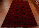 There are two unusual features about this piece, firstly it is a very unusual size as this length is 289 centimetres and the width 147 centimetres and secondly the design is one of the lesser-used by the Turkoman weavers.   A beautifully deep, luscious red is the back ground with 7 bands of border in deep blue wool highlighting the decoration.  The central section of the rug has 12 medallions laid out evenly and symmetrically across it.