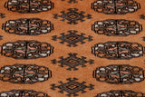 Hand-made Pakistan Bokhara rugs have a lovely silky smooth feel. Sometimes they are mistaken for silk as the wool is so soft and fine. They are hand knotted in the villages around Lahore Pakistan. The background colour of this rug is old gold. The design in the centre is a traditional repeating small lozenge in two vertical columns. Other colours used in the rug are a soft peach, cream and pale green.