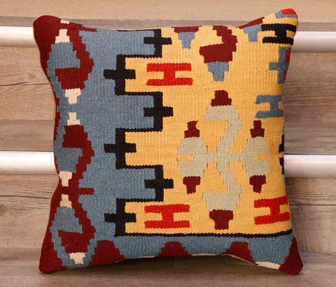 The pieces are often salvaged from old Turkish kilim so the pattern may be cut in unusual and interesting ways.  The decoration is made up of geometric shapes. The brightly coloured Kilim has touches of vibrant reds, soft blues, yellows, blacks and burgundy which contrast against the other colours on the facing side, whereas the back of the cushion is Faux suede or cotton.