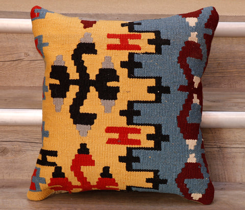 The pieces are often salvaged from old Turkish kilim so the pattern may be cut in unusual and interesting ways.  The decoration is made up of geometric shapes. The brightly coloured Kilim has touches of vibrant reds, soft blues, yellows, blacks and burgundy which contrast against the other colours on the facing side, whereas the back of the cushion is Faux suede or cotton.