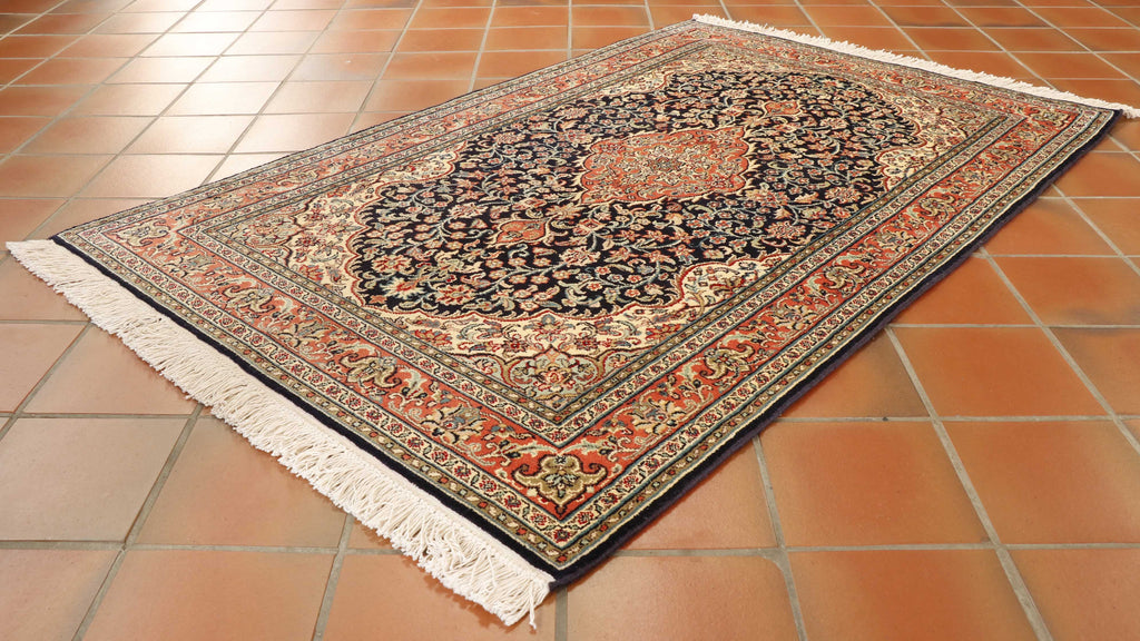 Luxurious handmade Kashmir silk rug with ornate central medallion