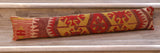 Geometric pattern.  Dusky pink, yellow, red and burgundy colour palette. 